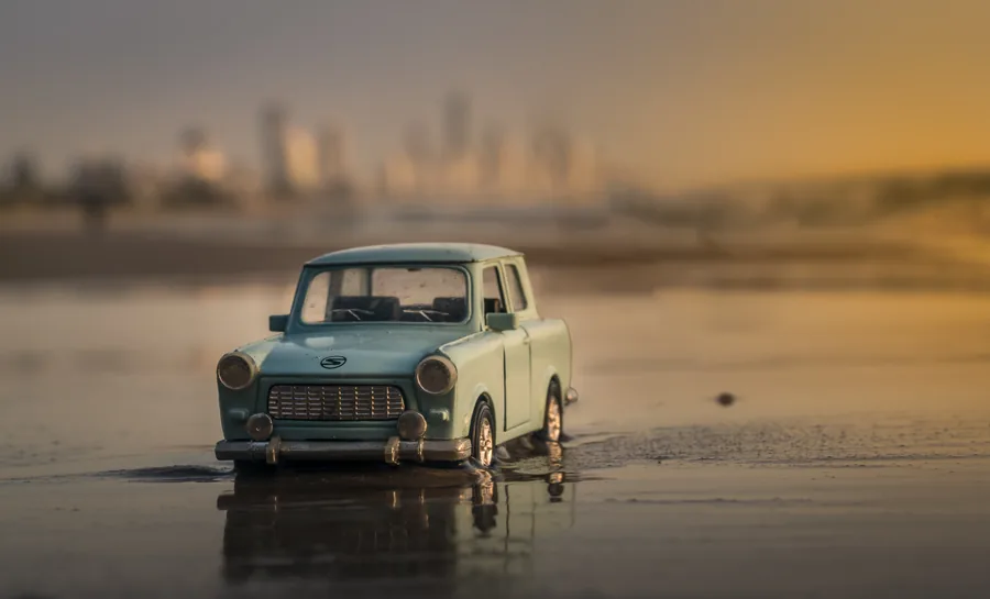 Toy Car on Wet Sand