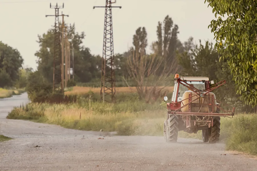 Tractor on the Dusty Lane